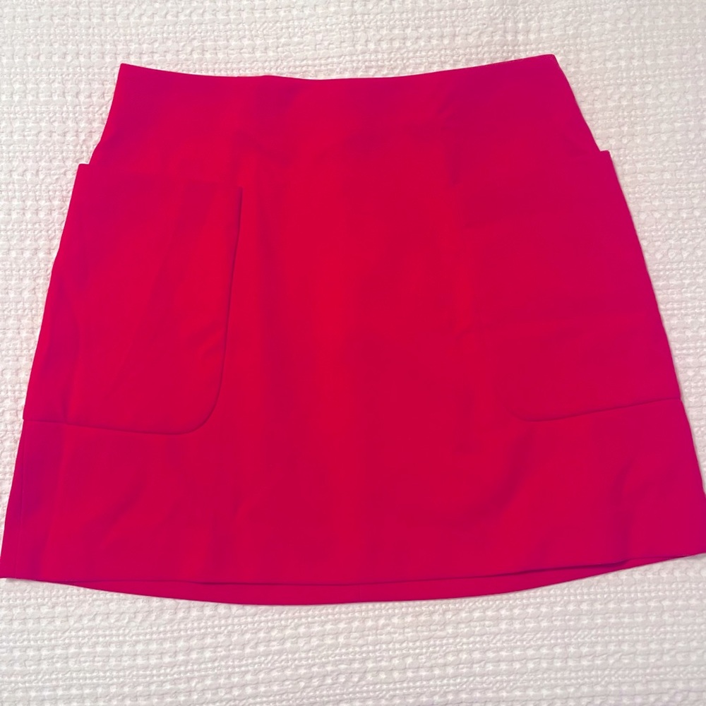 Red mini skirt with pockets! Very flattering & eye-catching! Mint condition